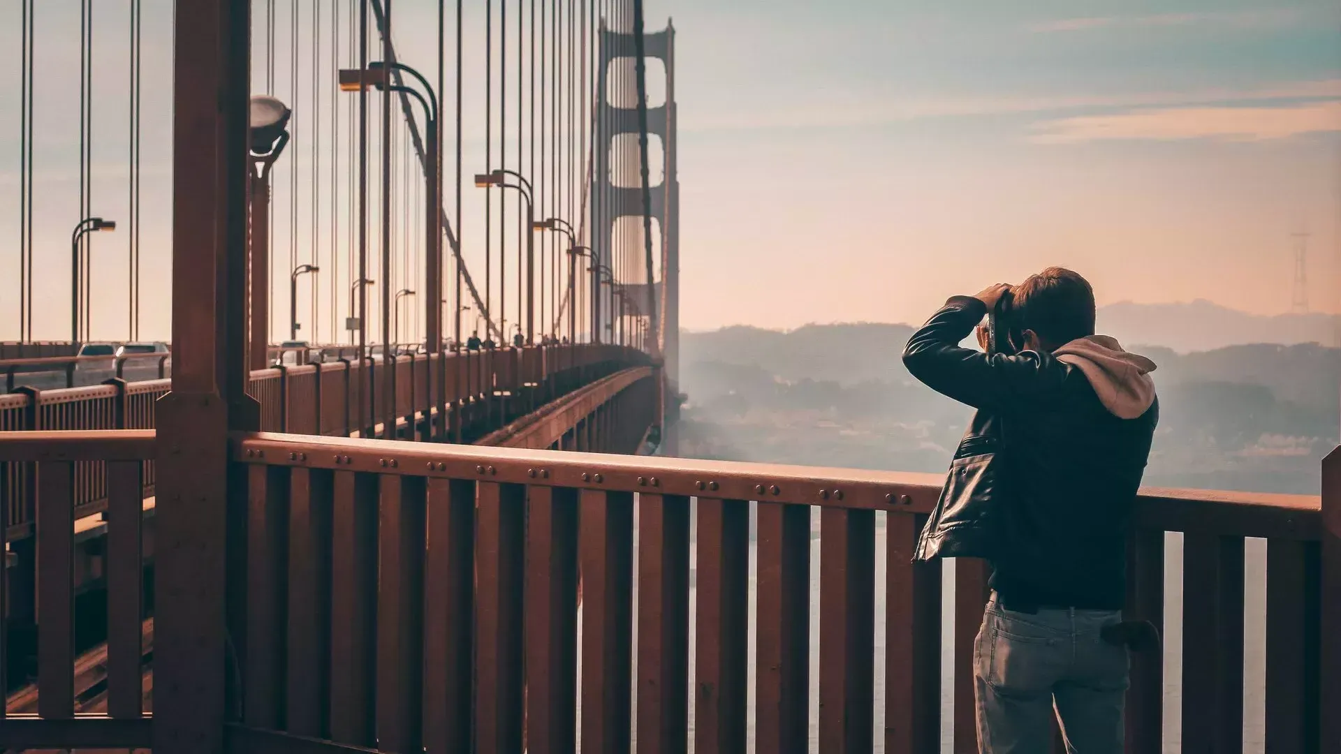 Man taking photos on the Golden Gate Bridge